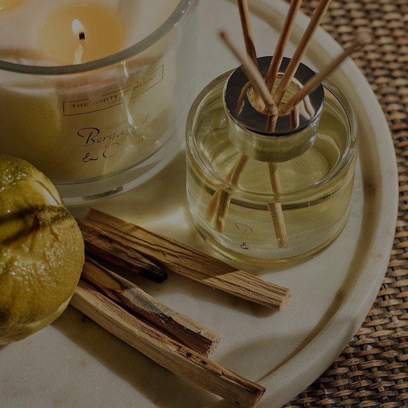 a close up of a plate of food and candles on a table