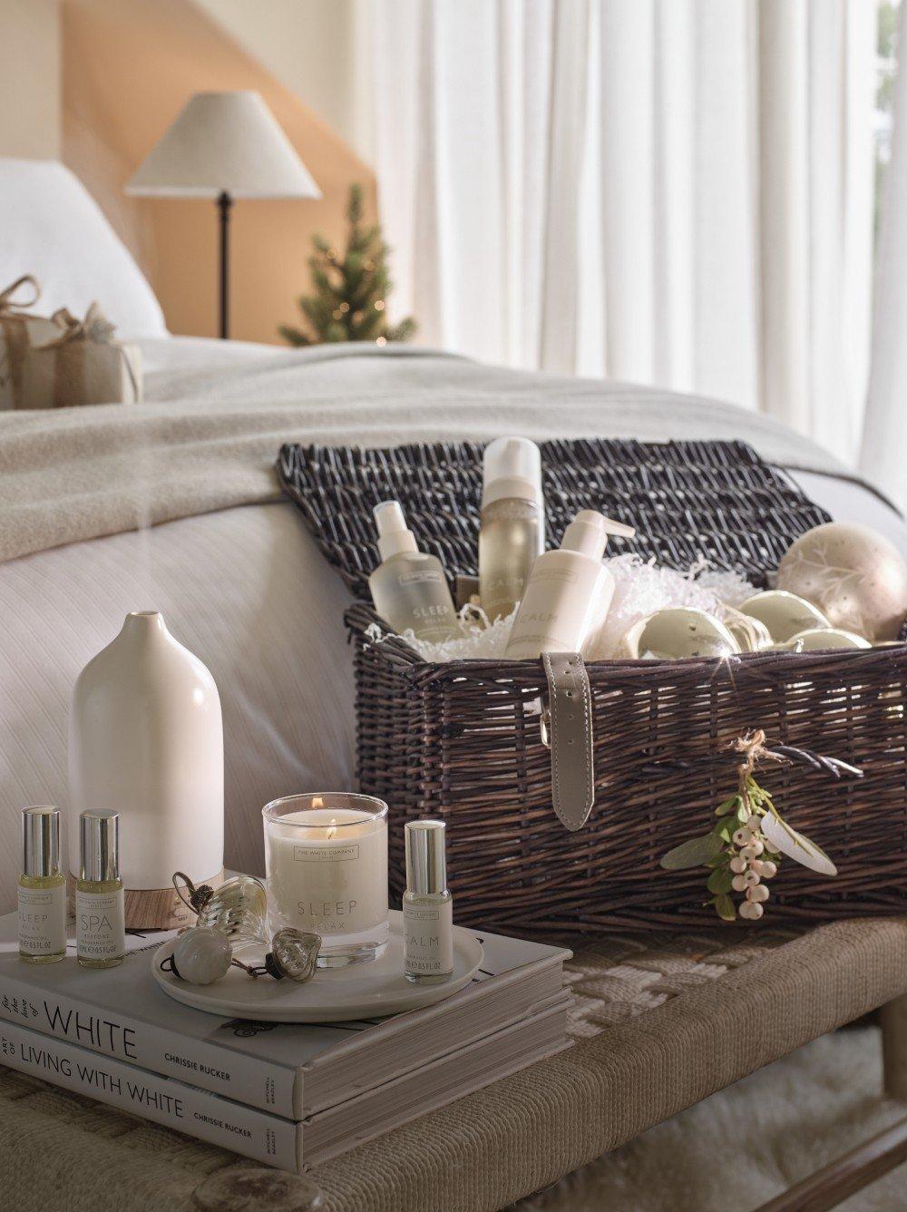 a towel, soap, and lotion on a counter next to a basket