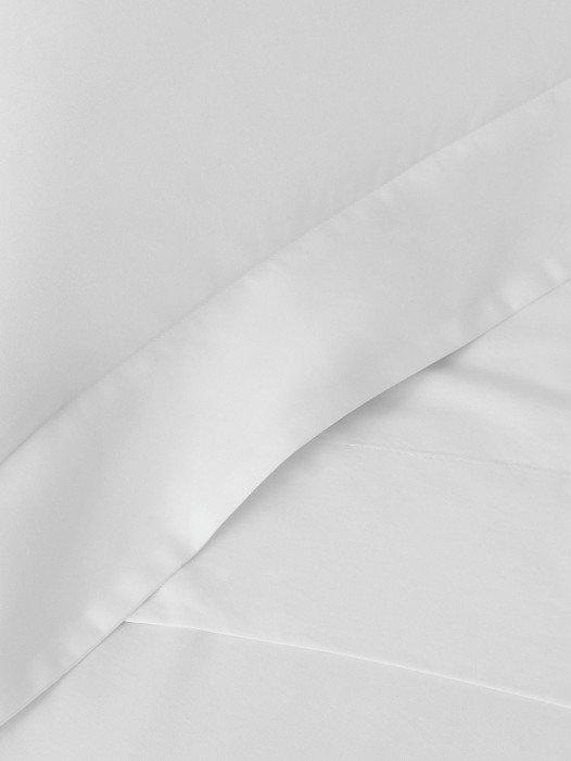 a close up of a white sheet with a folded edge