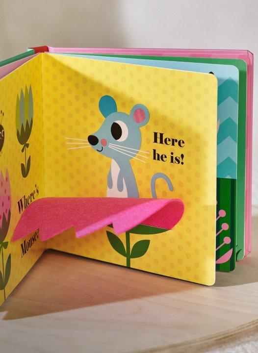 a book with a mouse on the cover and a paper cut out