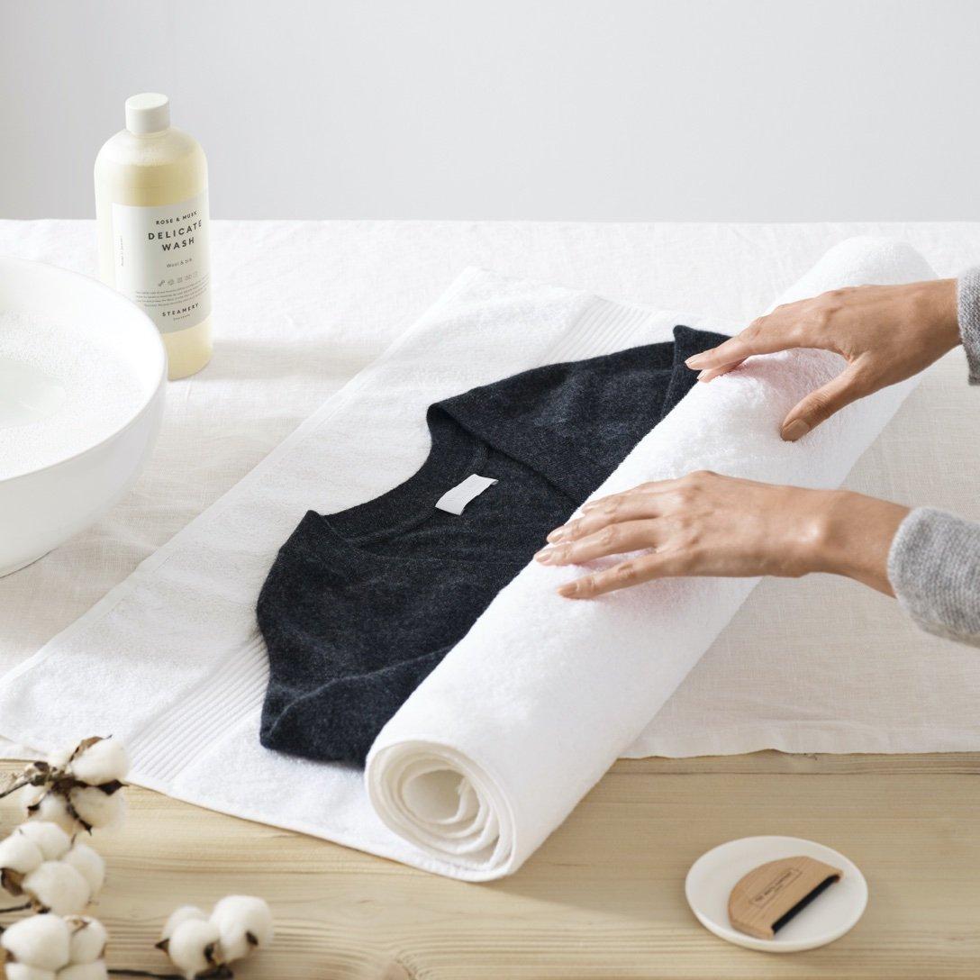 a towel with a cashmere piece rolled up