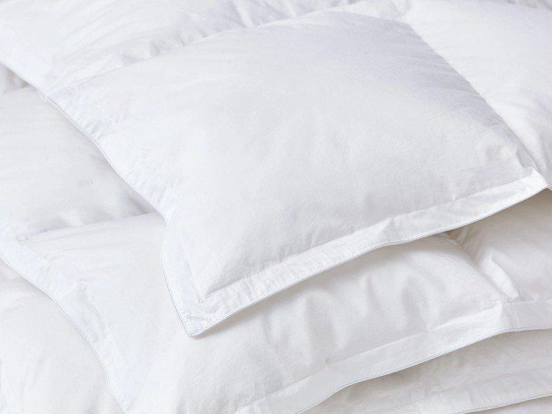 a close up of a pile of white pillows