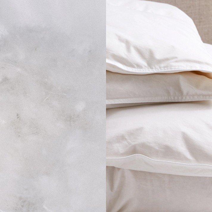 a close up of a white feather pillow and a white feather pillow