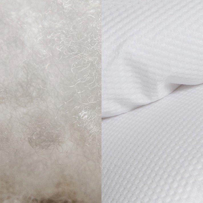 a close up of a white sheet and a white pillow case