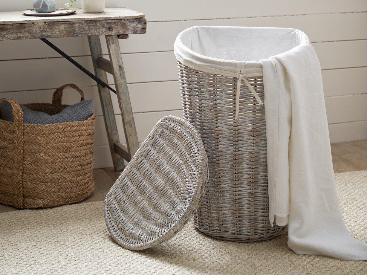 a basket with a towel and a blanket on top of it