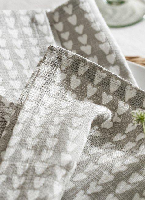 a close up of a napkin with hearts on it