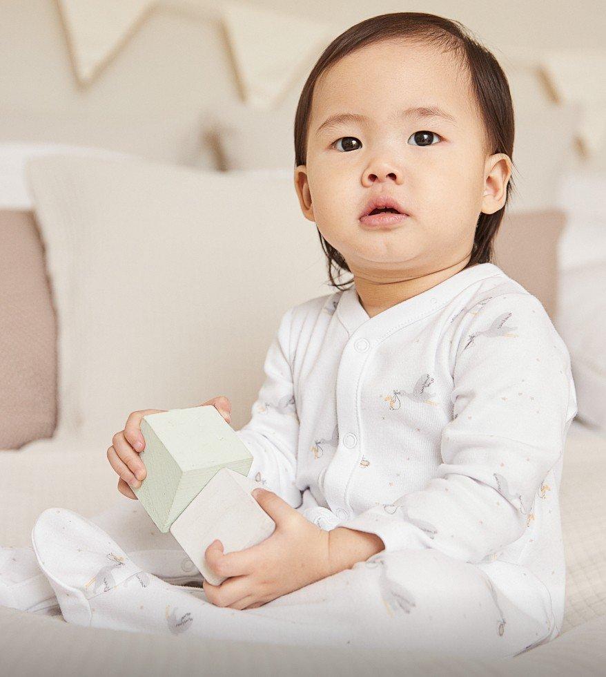 stork-print sleepsuit