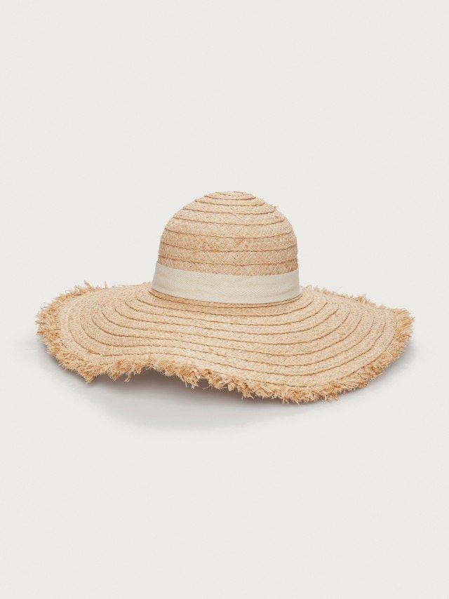 a straw hat with a fringed edge and a white background