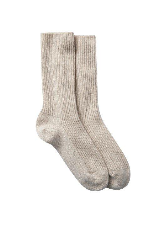 a pair of beige socks on a white background