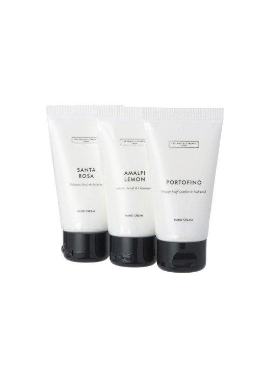 three tubes of hand cream on a white background