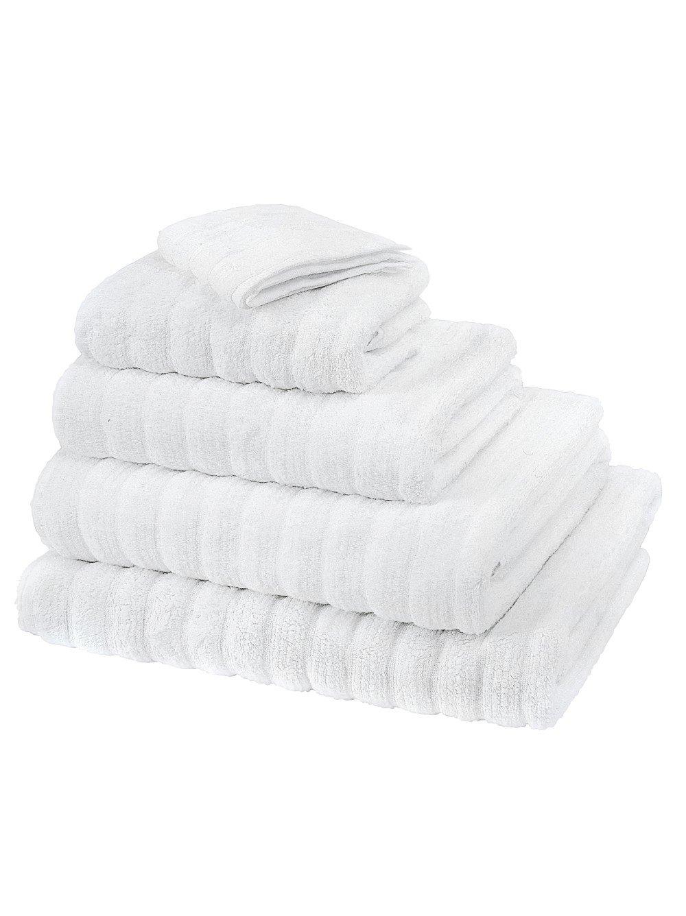 a stack of white towels on a white background