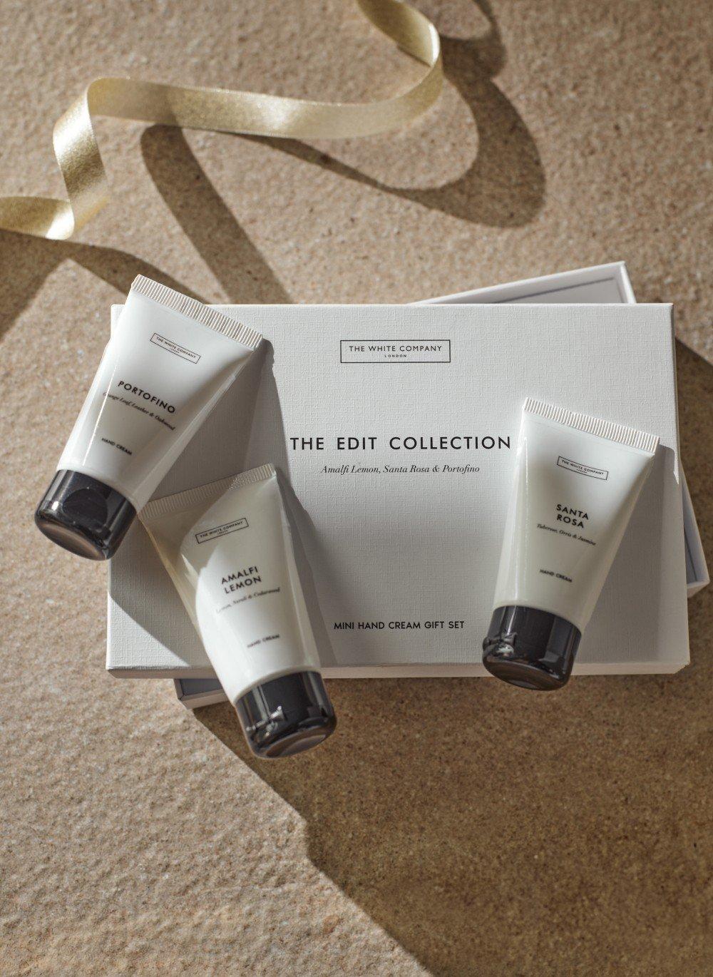 the gift set includes three tubes of hand cream and a box