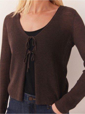 a close up of a brown cardigan