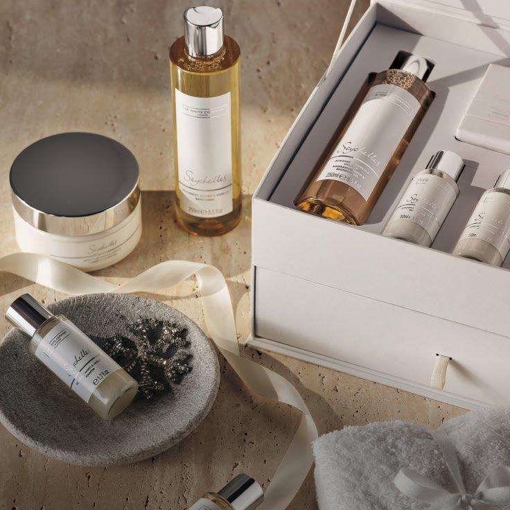 a tray with a candle, a gift, and a few other items