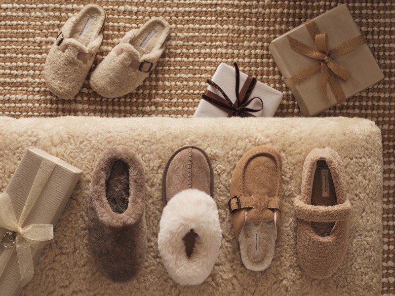 a group of five pairs of shoes and a box of presents