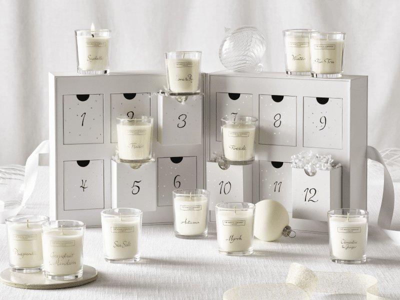 a table with candles and a calendar on it with candles