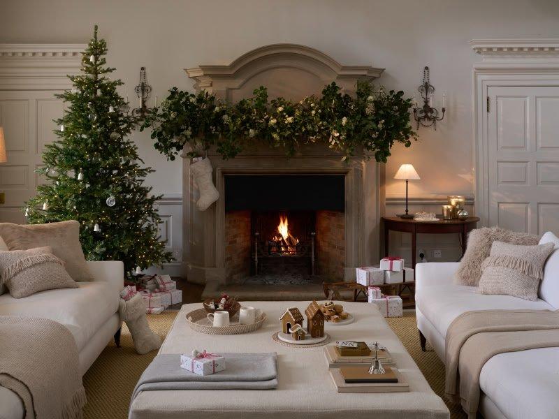 a living room with a table and a lamp on it