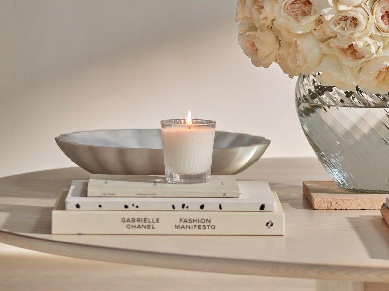 a table with candles and a calendar on it with candles