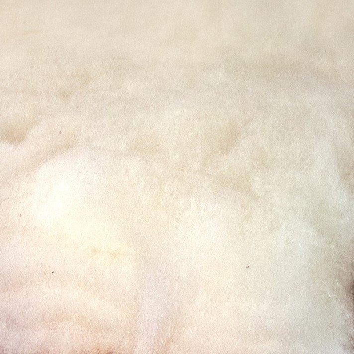 a close up of a white fluffy bedspread and a white fluffy pillow