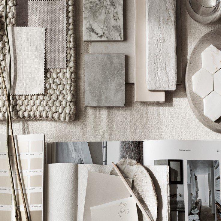 a wall with a variety of materials and papers on it
