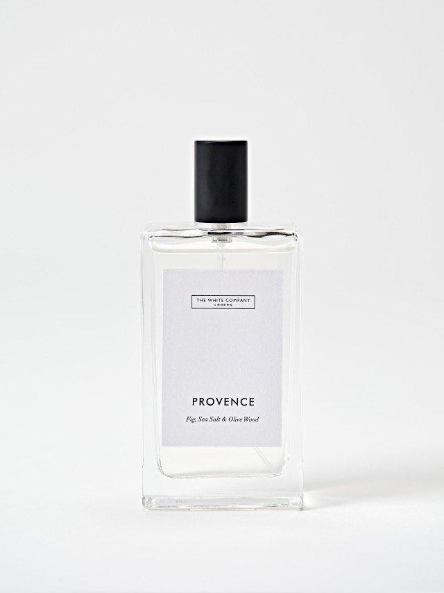 a bottle of perfume with a black label on it
