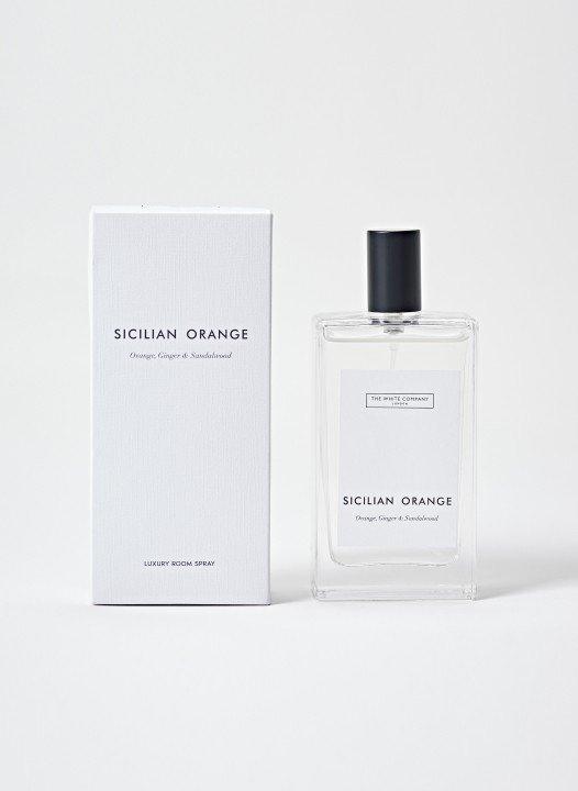 a bottle of sicilian orange cologne next to a box