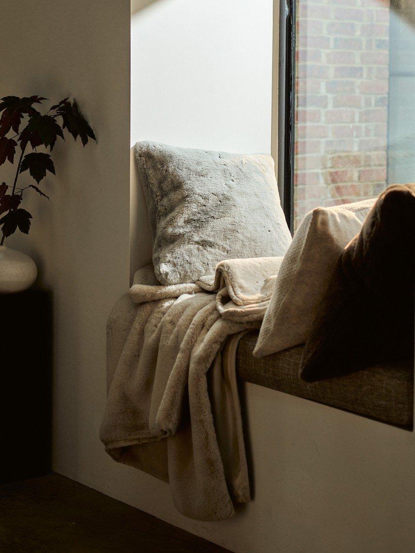 a window with a view of a city street and a window