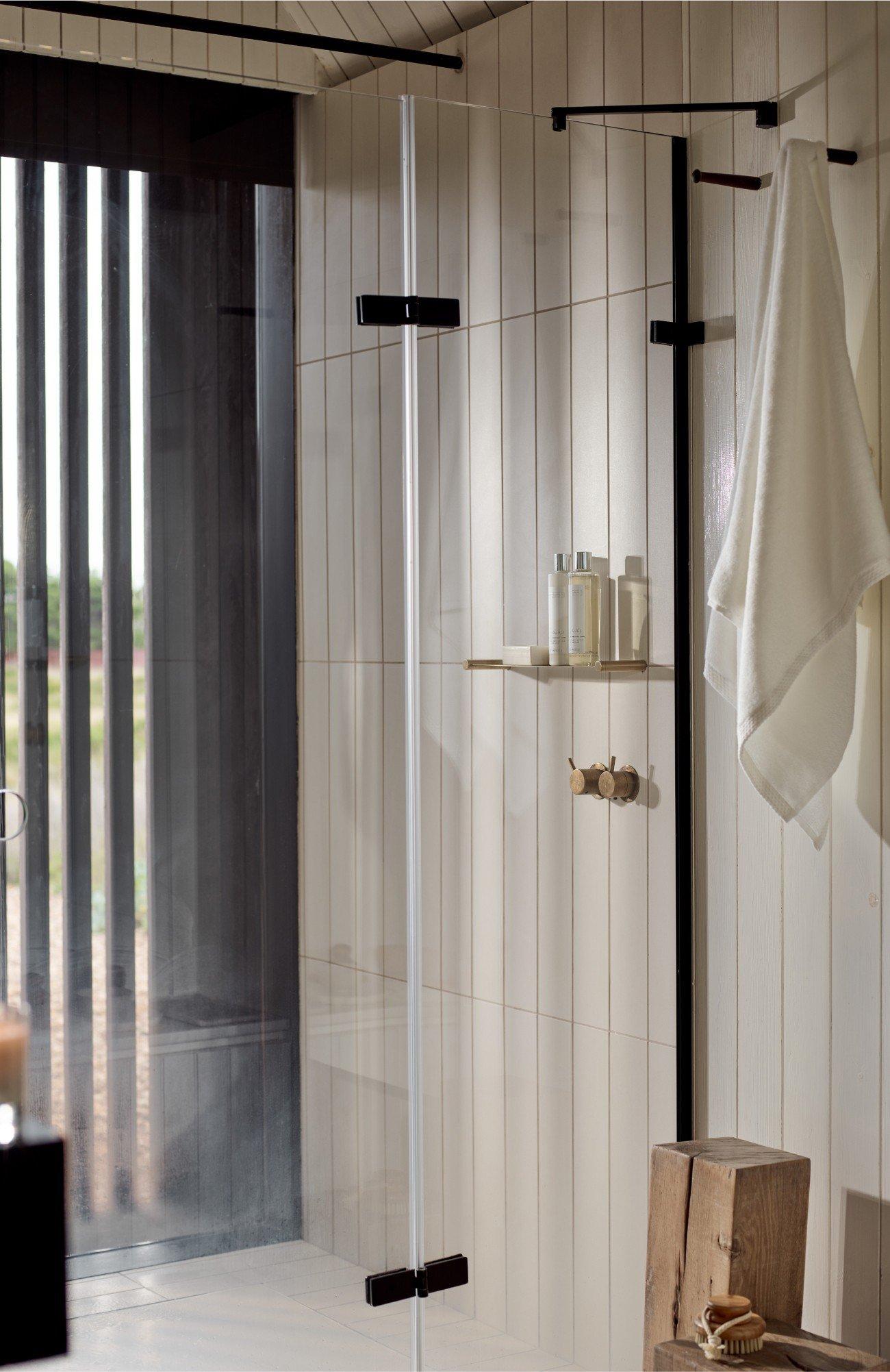 a bathroom with a shower and a toilet in it