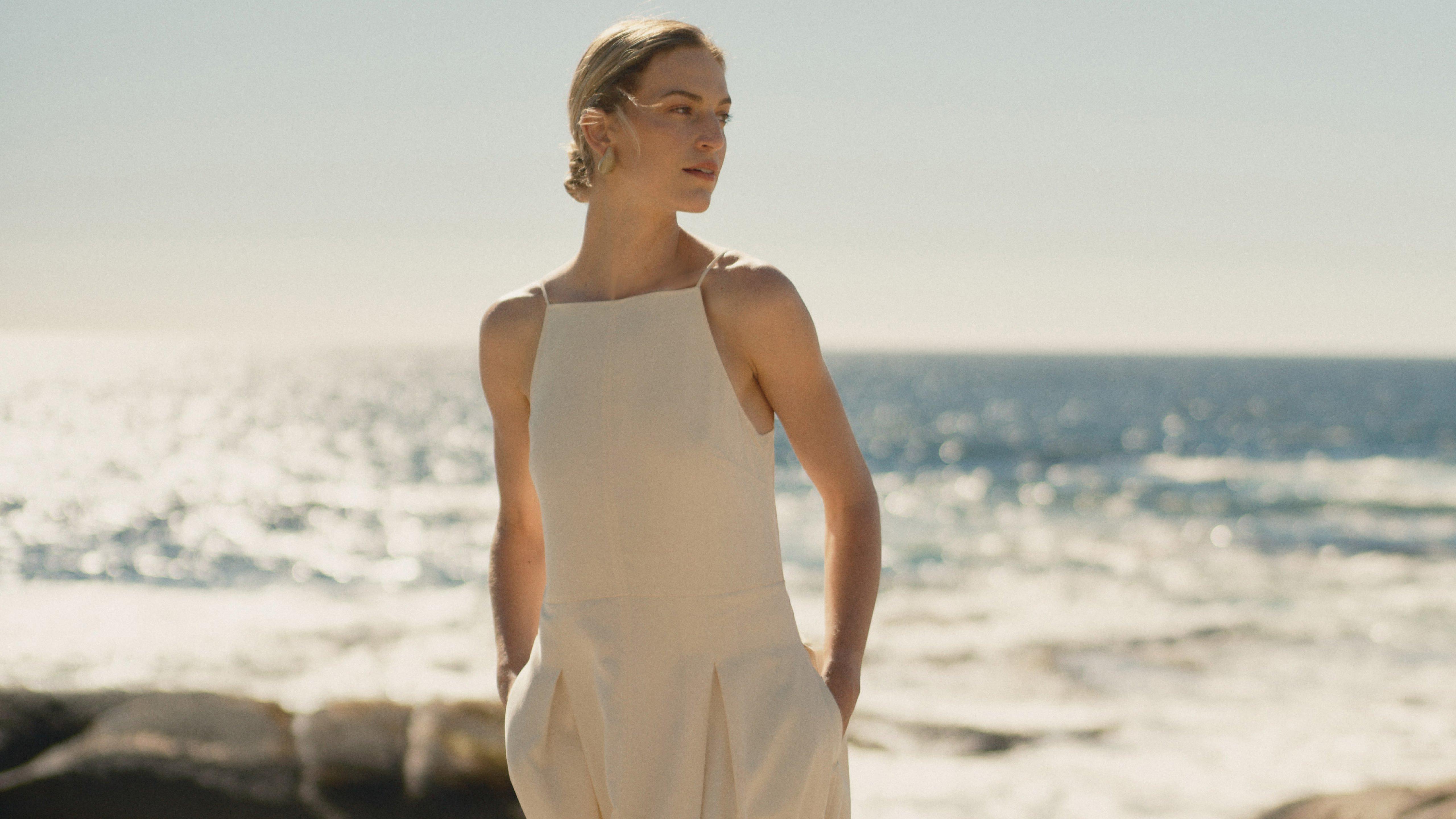 a woman in a white shirt posing on a boat