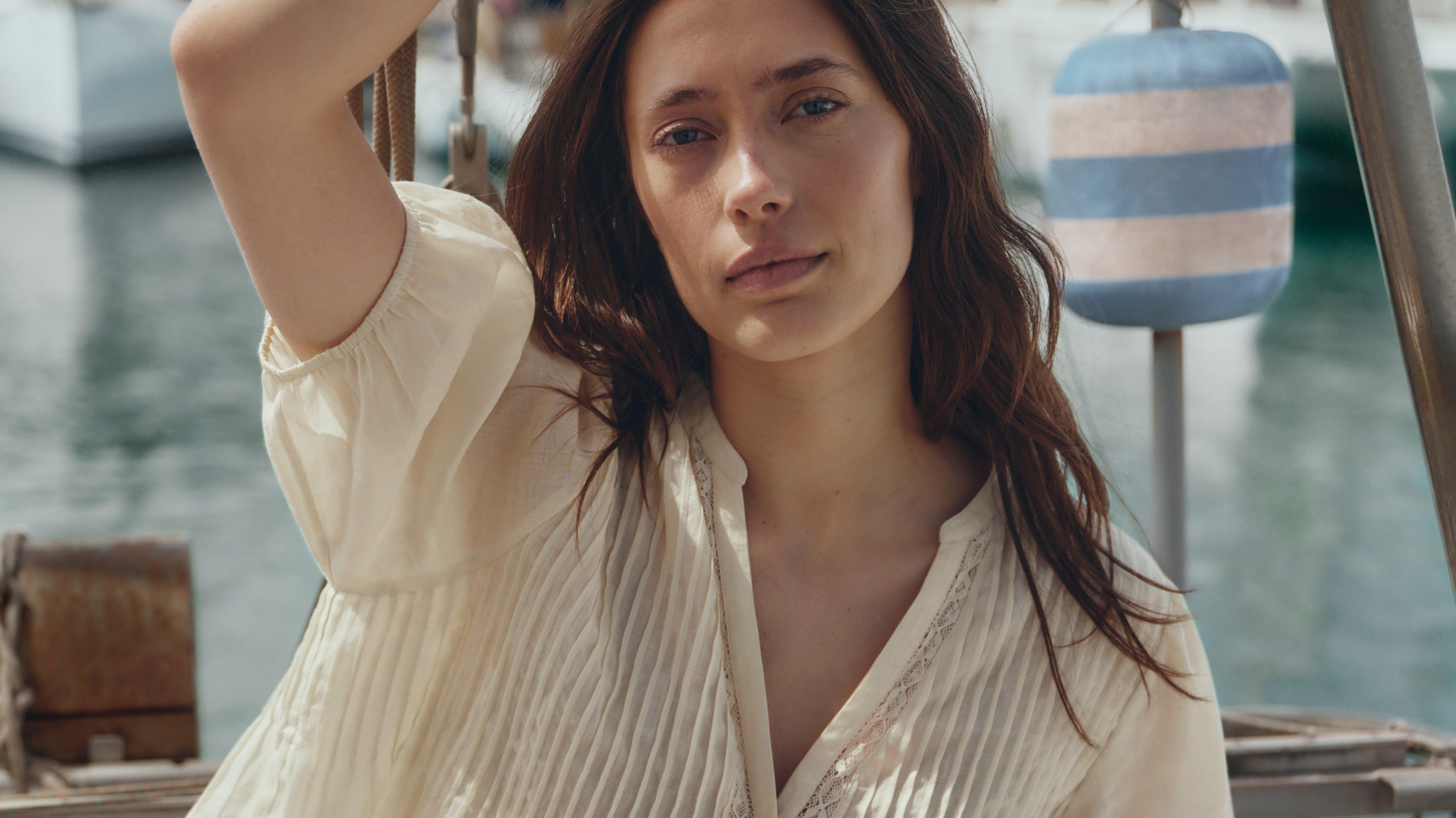 three women are smiling and laughing together