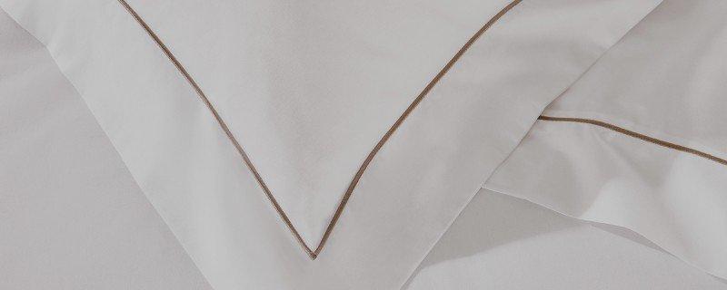 a close up of a white dress with a blue stripe