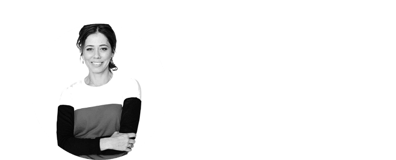 a woman smiling in a circle with her arms crossed