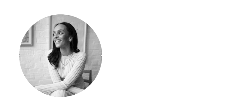 a woman smiling in a black and white photo