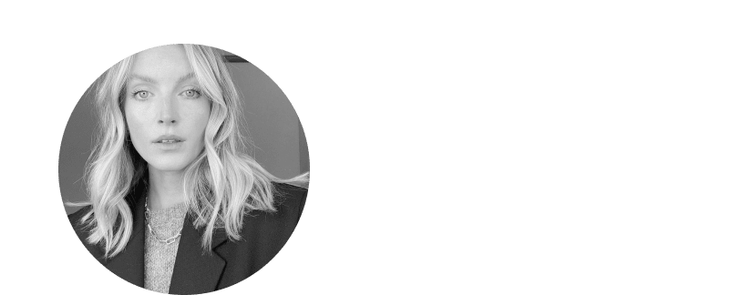 a woman with blonde hair and a jacket on in a circle