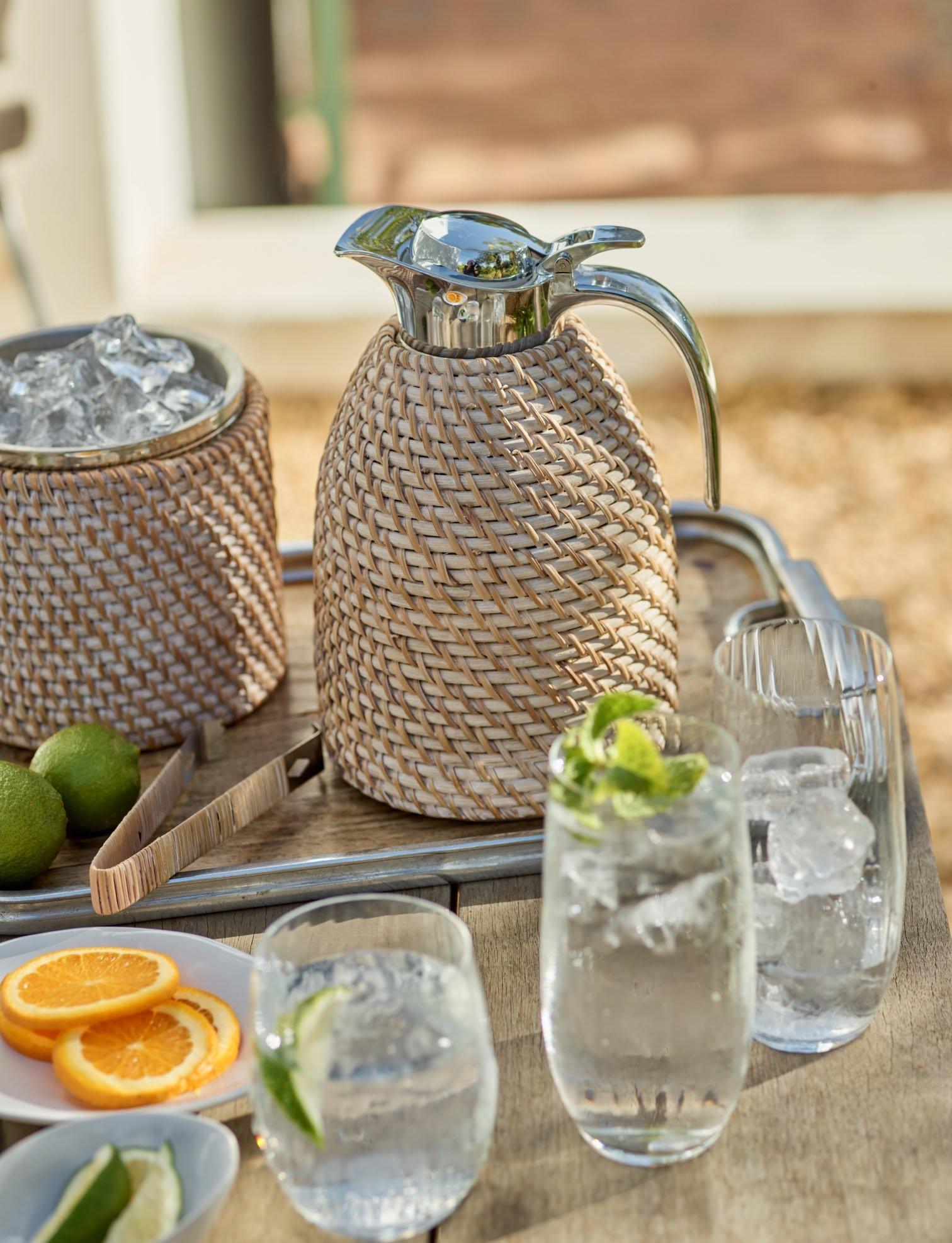 a tray with glasses, water, and a pitcher of lemonade