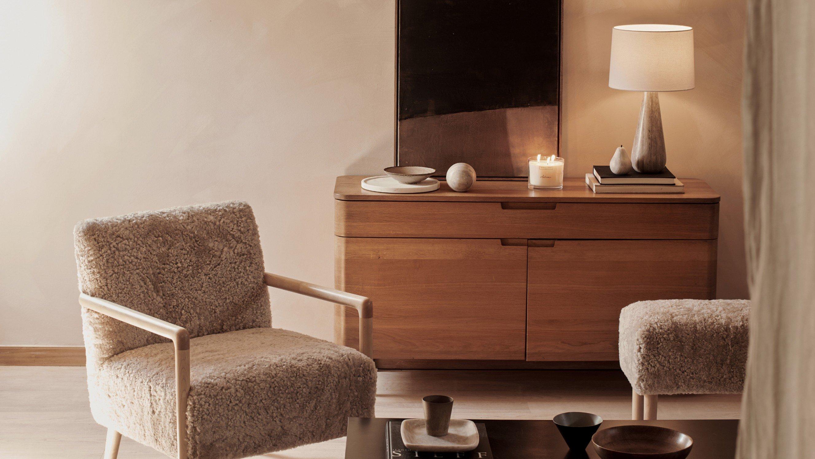 a bed with white sheets and pillows in a bedroom