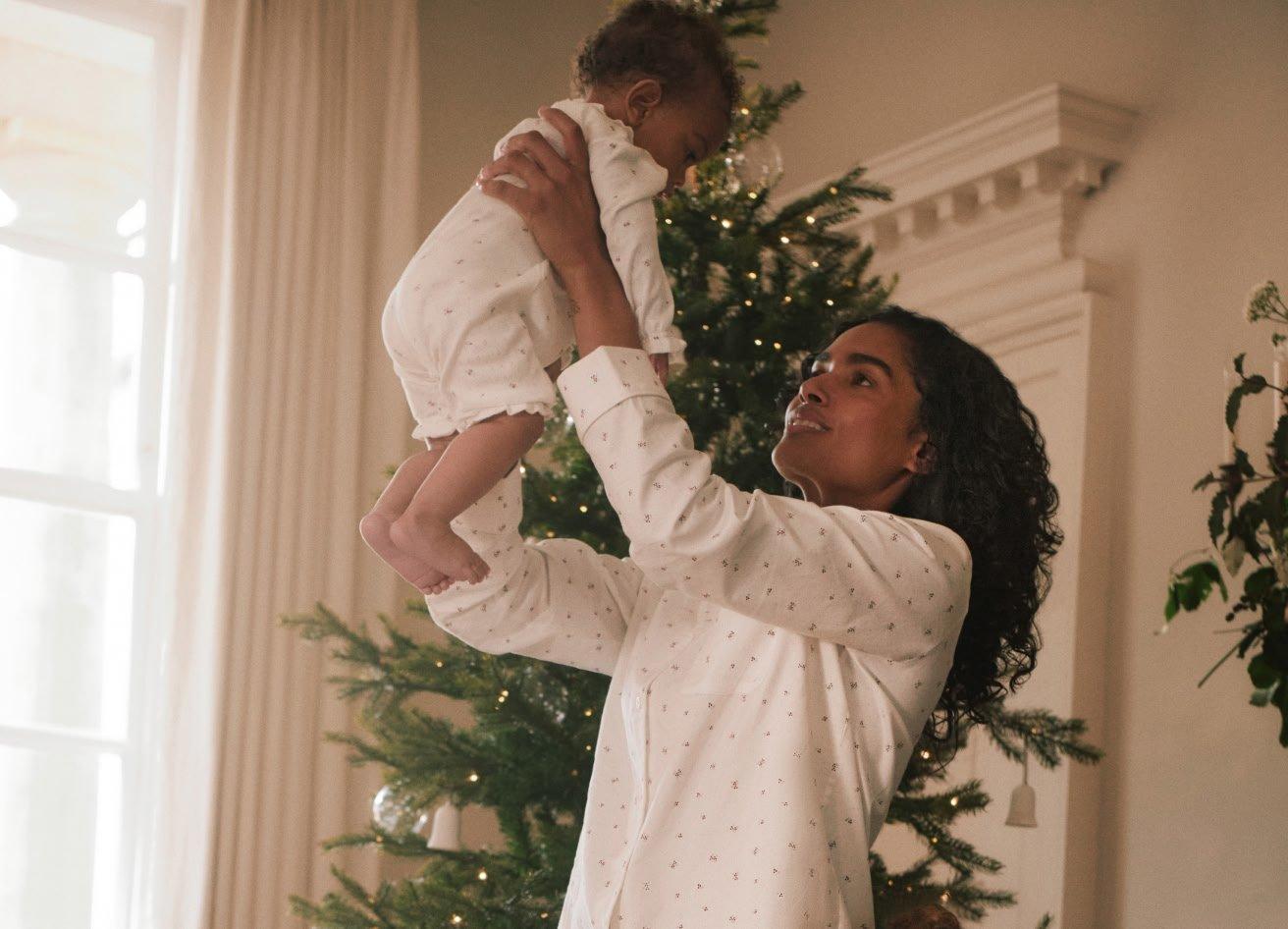 a woman and two children on a couch together