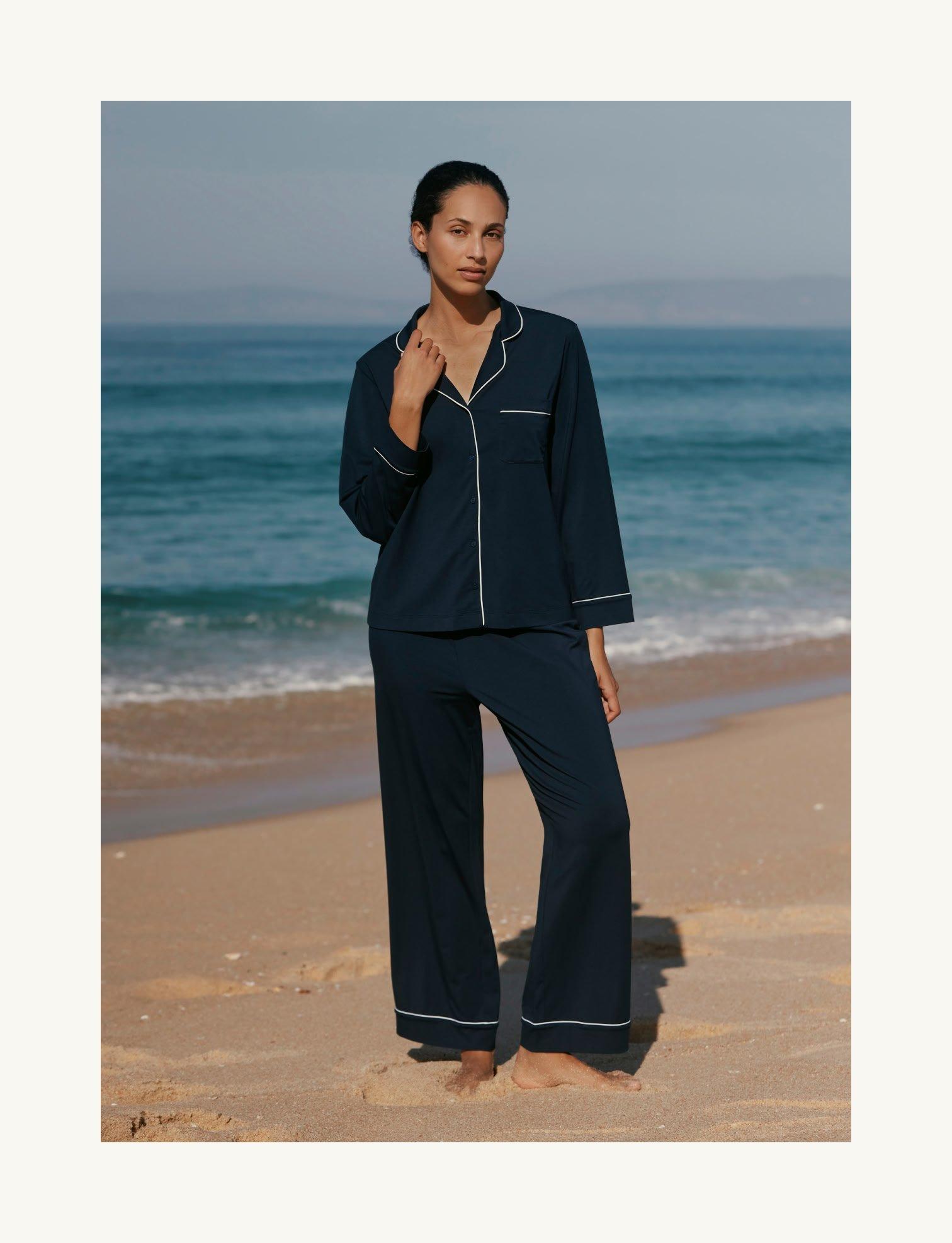 woman wearing pyjamas on beach