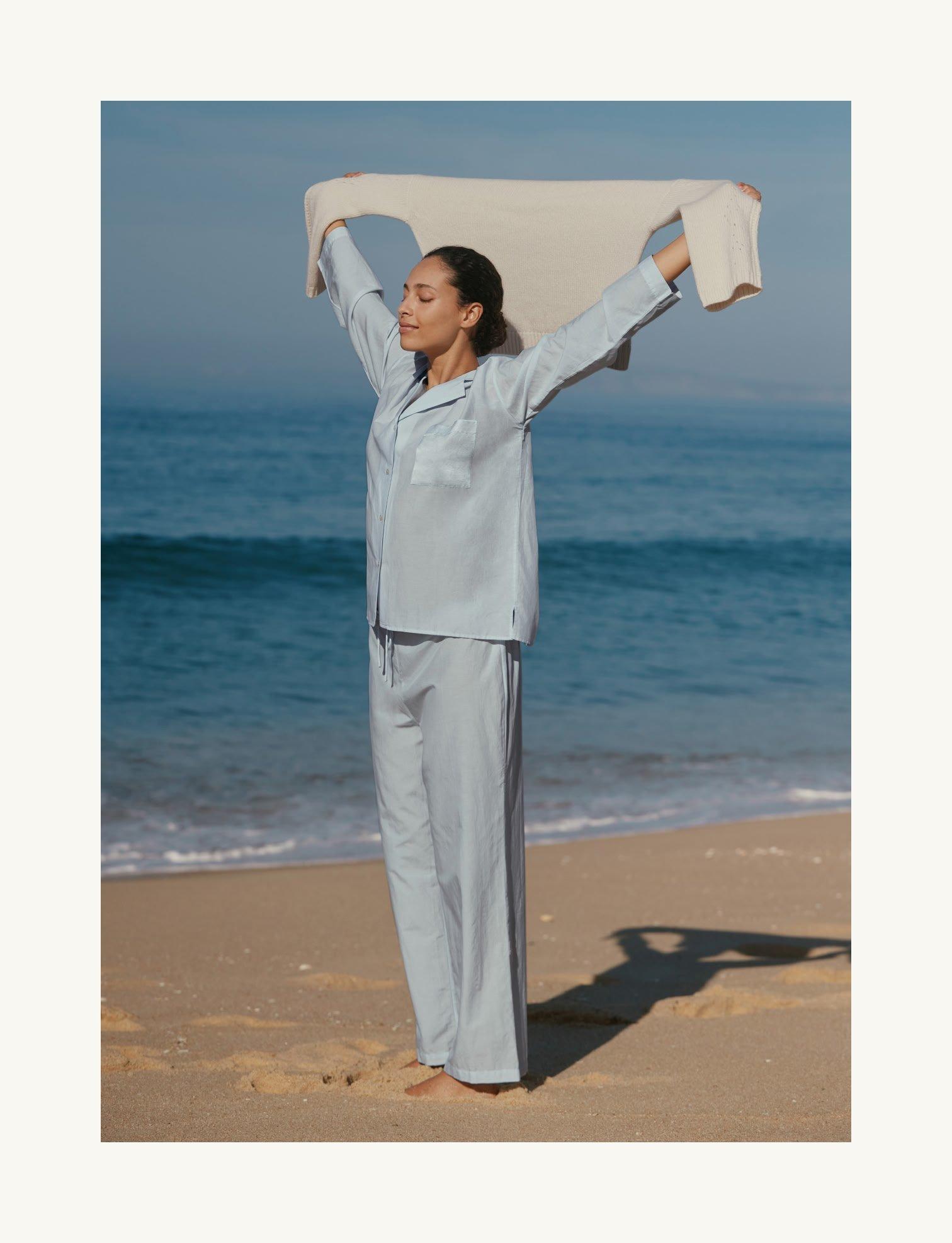 woman wearing pyjamas on beach
