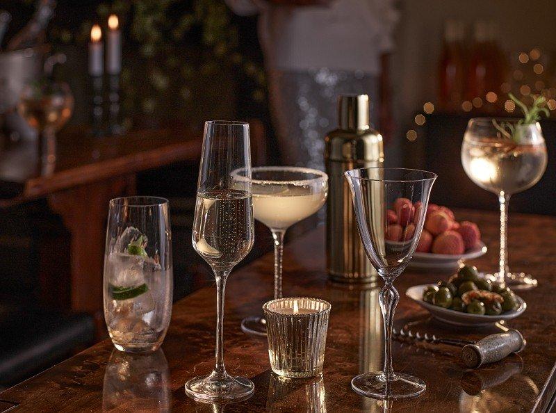 a table with several glasses of wine and other drinks