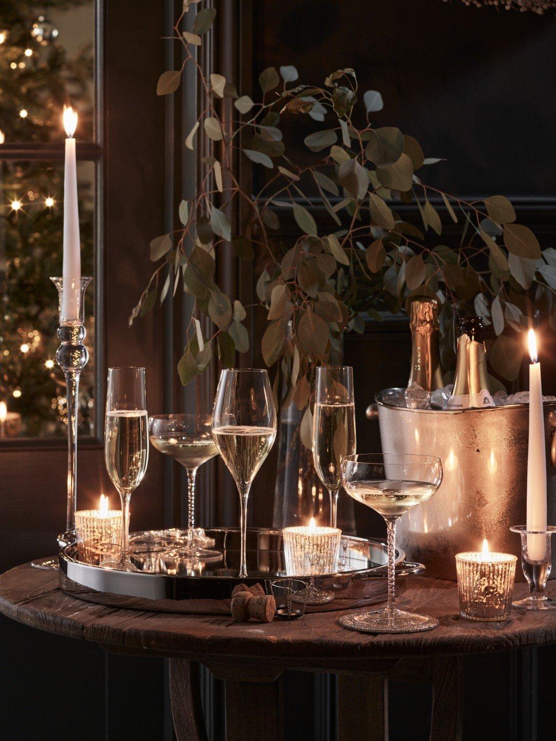 a table with a bunch of wine glasses and candles