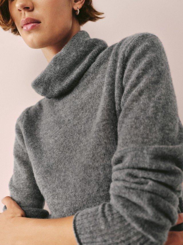 a woman with a yellow tennis ball on her head