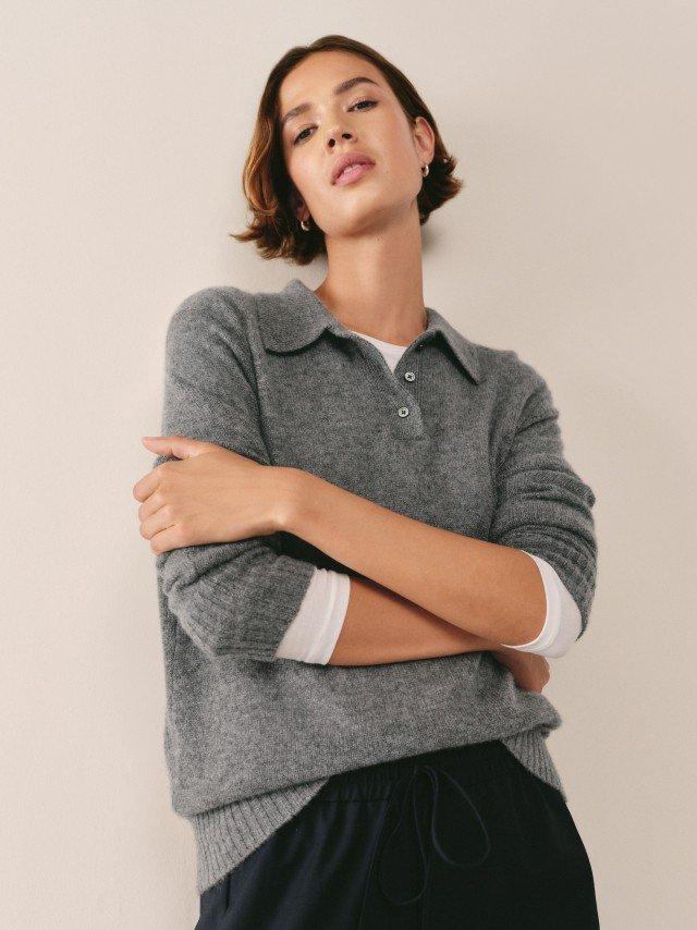 a woman with a yellow tennis ball on her shoulder