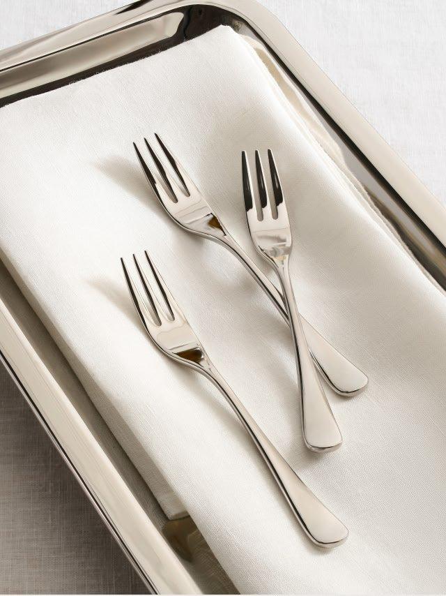 a tray with three forks and a knife on it