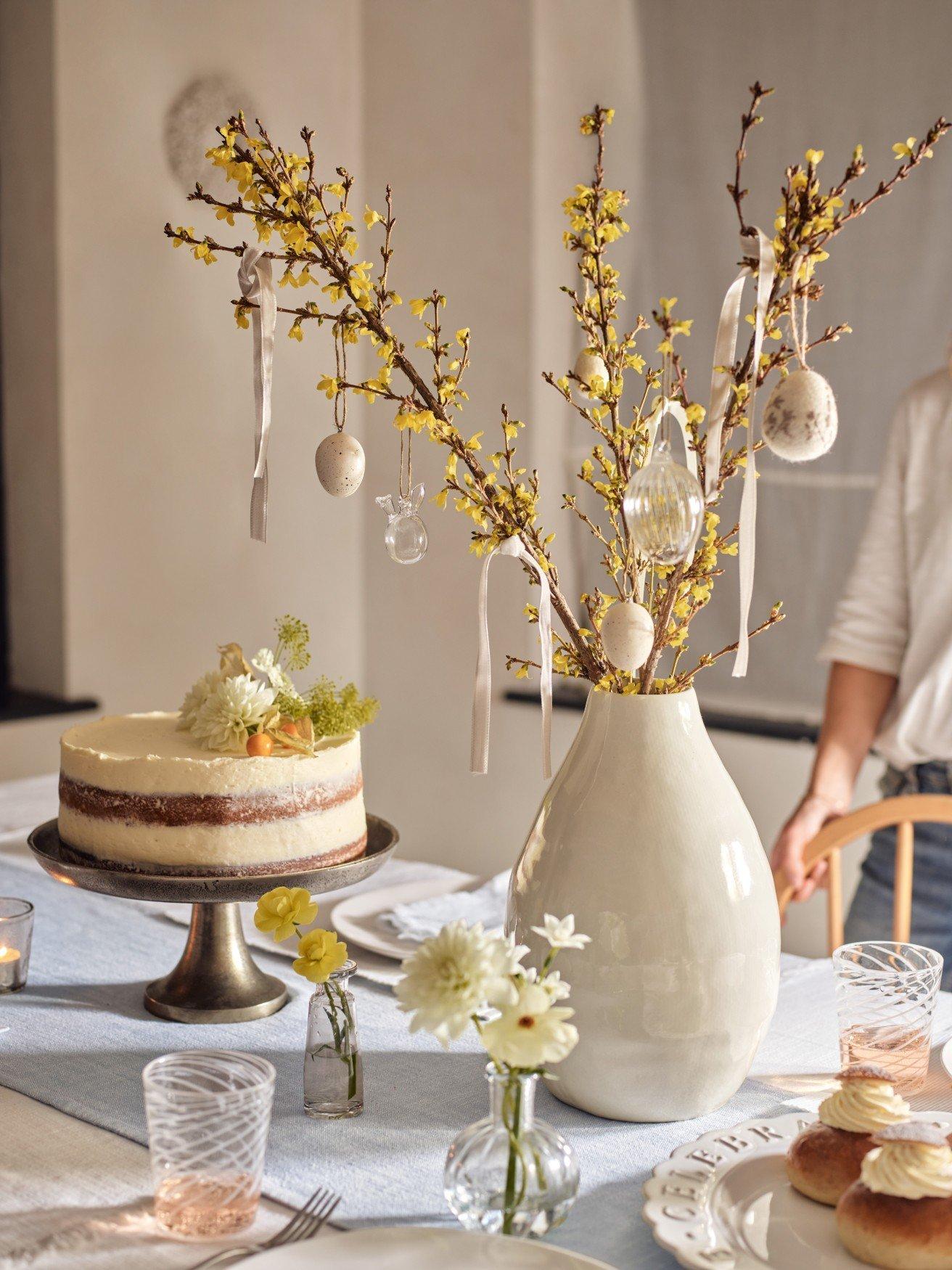 a table with a cake and a plate of food on it