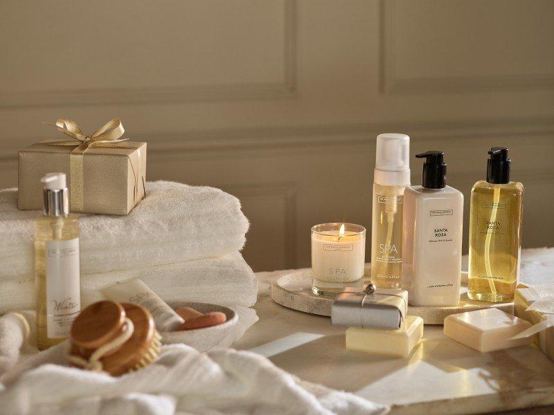 a bathroom with a lot of different types of soaps and candles