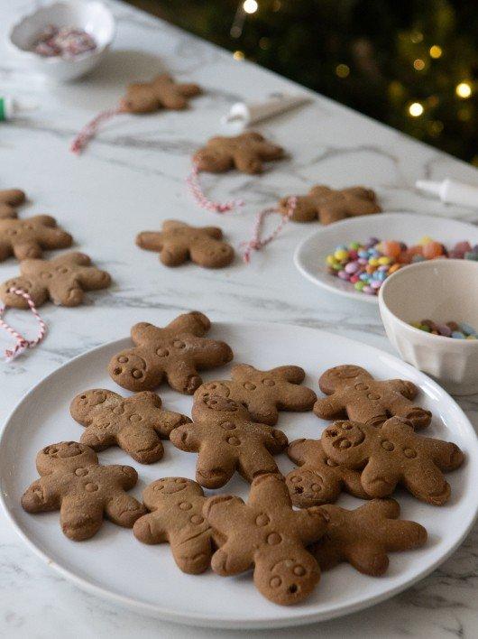 a plate of cookies on a table with candy and other treats