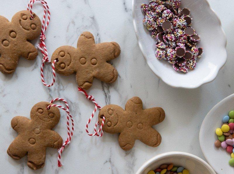 a table with a bowl of candy and a plate of cookies