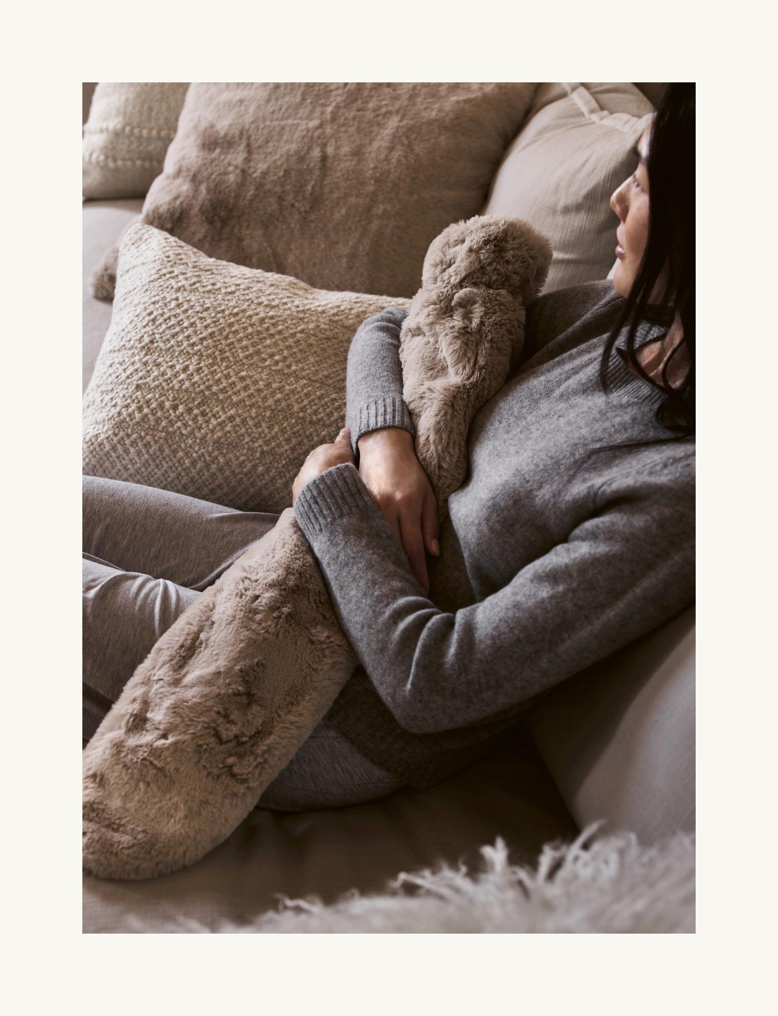 woman with hot water bottle