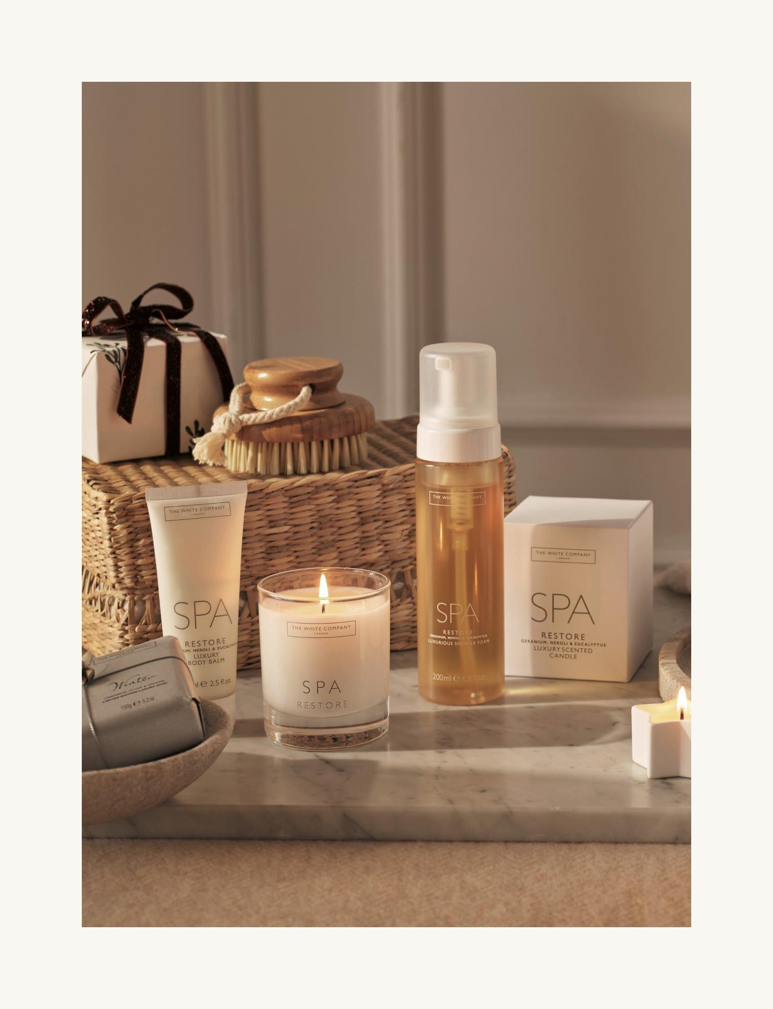 shower foam, candle and lotion